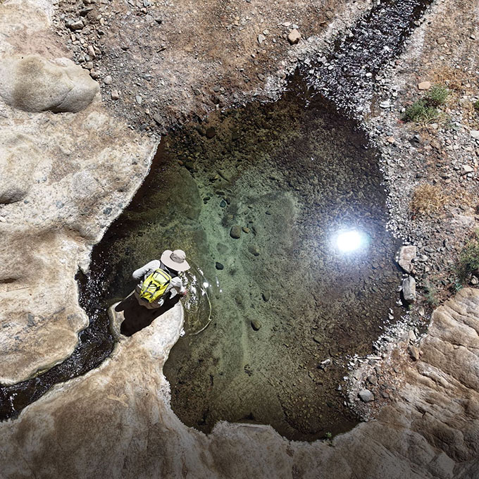 Natural twin rock pools fed by ancient springs in Wadi Tayyib al Ism